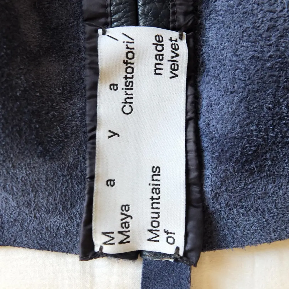 Vertical Christofori label on blue velvet