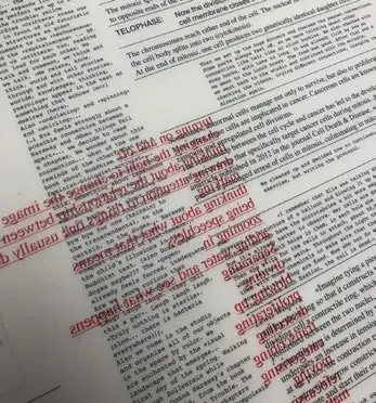 Thin risograph paper with text showing through